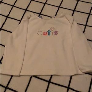 A baby shirt that says cutie